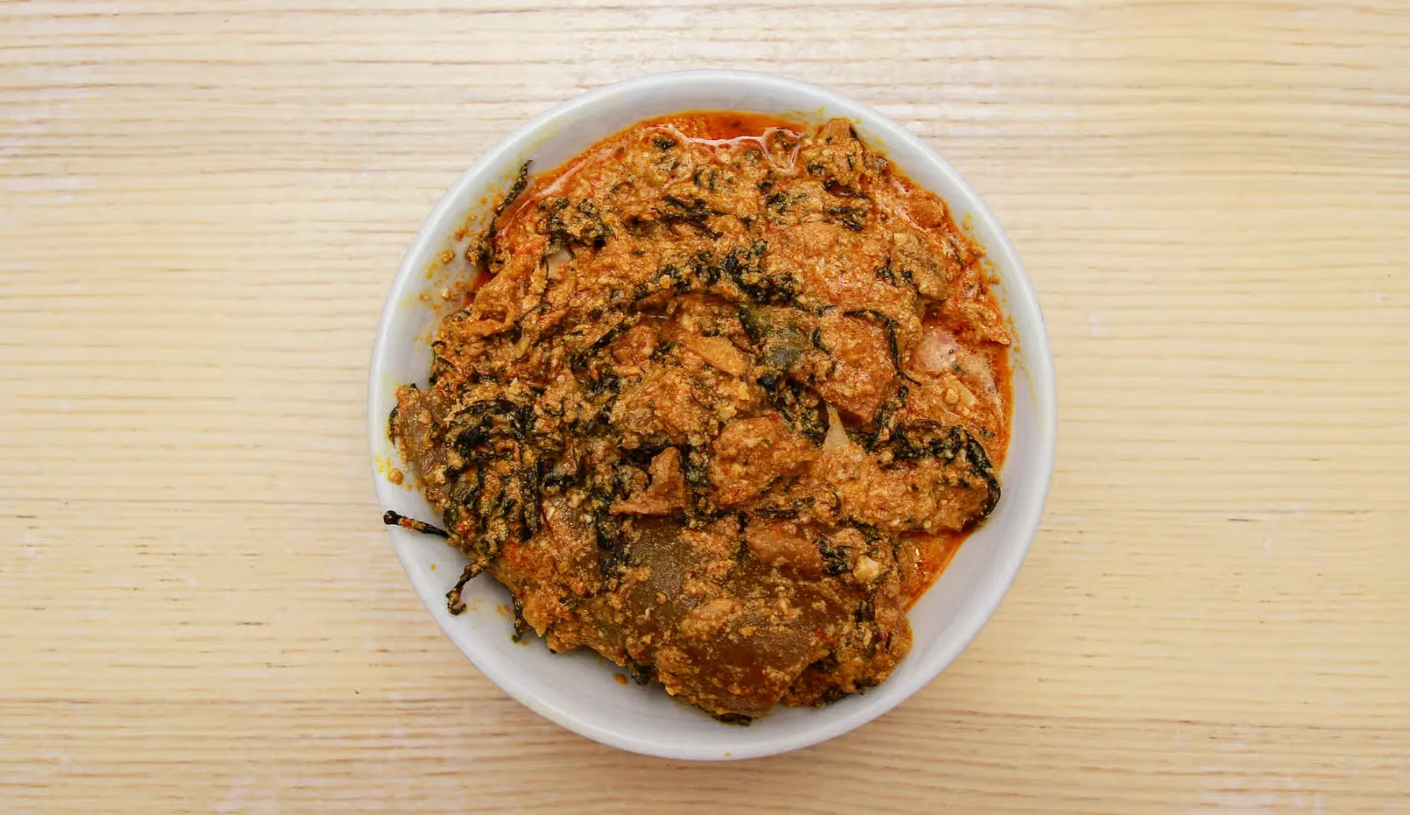 Egusi Soup with pounded yam at Lochi Afro Nija Nigerian restaurant in Edmonton, AB